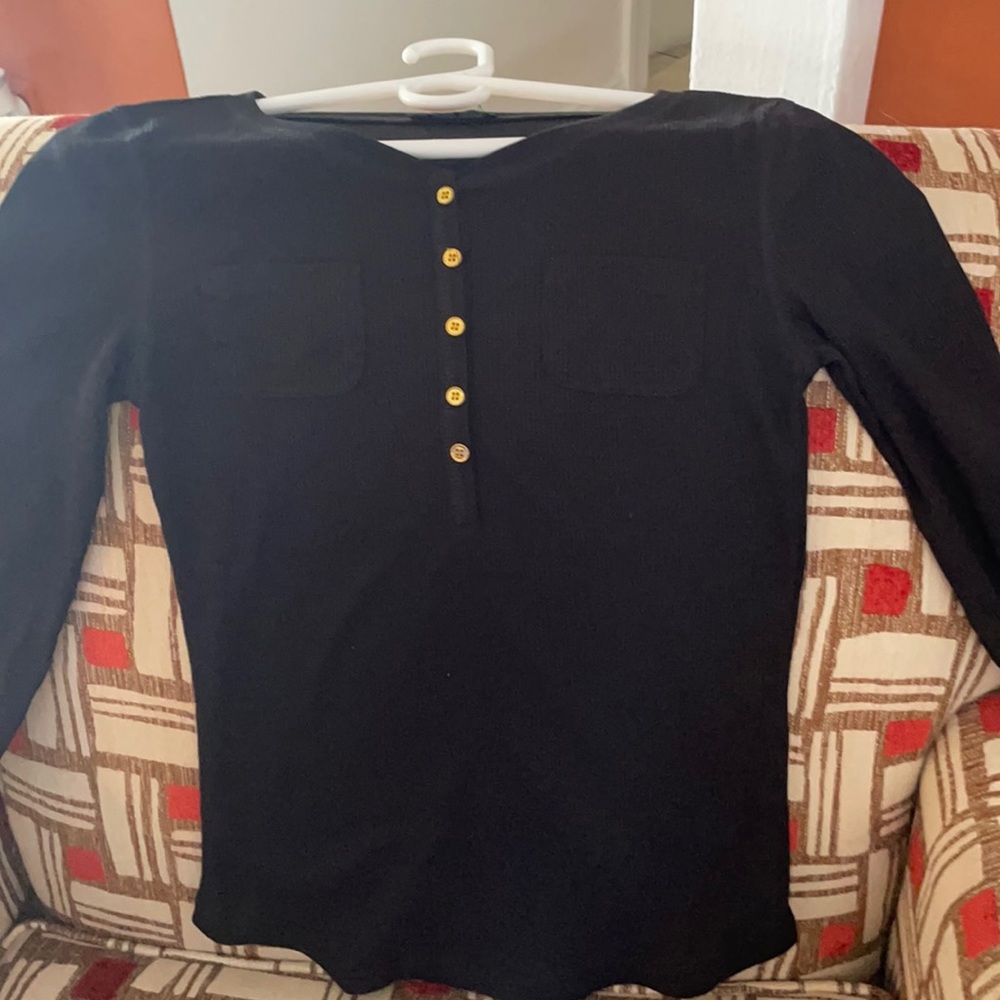 A black long sleeve sweater.